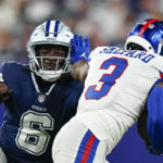 
              New York Giants wide receiver Sterling Shepard (3) tries to avoid a tackle by Dallas Cowboys safety Donovan Wilson (6) during the first quarter of an NFL football game, Monday, Sept. 26, 2022, in East Rutherford, N.J. (AP Photo/Frank Franklin II)
            