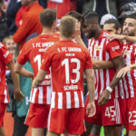 
              Union's scorer Jordan Siebatcheu, fourth right, and his teammates clebrate the opening goal during the Bundesliga soccer match between 1. FC Union Berlin and Vfl Wolfsburg in Berlin, Germany, Sunday, Sept. 18, 2022. (Andreas Gora/dpa via AP)
            
