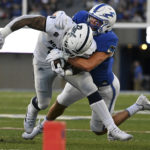 
              Air Force linebacker Alec Mock, right, tackles Nevada running back Toa Taua, left, after a run during the second quarter of an NCAA college football game Friday, Sept. 23, 2022, in Air Force Academy, Colo. (Christian Murdock/The Gazette via AP)
            