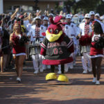 
              The South Carolina mascot and the marching band lead the Gamecock walk before an NCAA college football game against Georgia on Saturday, Sept. 17, 2022 in Columbia, S.C.  (AP Photo/Artie Walker Jr.)
            