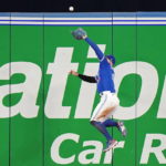 
              Toronto Blue Jays center fielder George Springer makes a catch at the wall on a ball hit by Tampa Bay Rays' Ji-Man Choi during  the fourth inning of a baseball game Wednesday, Sept. 14, 2022, in Toronto. (Frank Gunn/The Canadian Press via AP)
            