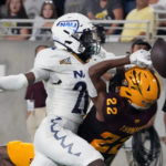 
              Northern Arizona defensive back Colby Humphrey knocks the ball away from Arizona State wide receiver Bryan Thompson (22) during the first half of an NCAA college football game Thursday, Sept. 1, 2022, in Tempe, Ariz. (AP Photo/Rick Scuteri)
            