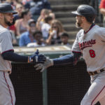 
              Minnesota Twins' Jake Cave (8) is congratulated by Gary Sanchez after hitting a solo home run off Cleveland Guardians starting pitcher Cody Morris during the second inning of a baseball game in Cleveland, Sunday, Sept. 18, 2022. (AP Photo/Phil Long)
            