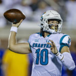 
              FILE - Coastal Carolina quarterback Grayson McCall looks to pass against Kansas during the first half of an NCAA college football game in Conway, S.C., Friday, Sept. 10, 2021. The Sun Belt Conference has done plenty to past few seasons to catch college football's attention. Those in charge believe the league took additional steps this offseason to keep that going. (AP Photo/Nell Redmond, File)
            