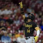 
              Pittsburgh Pirates' Rodolfo Castro points to the sky as he celebrates hitting a three-run home run during the fifth inning of a baseball game against the Cincinnati Reds in Cincinnati, Monday, Sept. 12, 2022. (AP Photo/Aaron Doster)
            