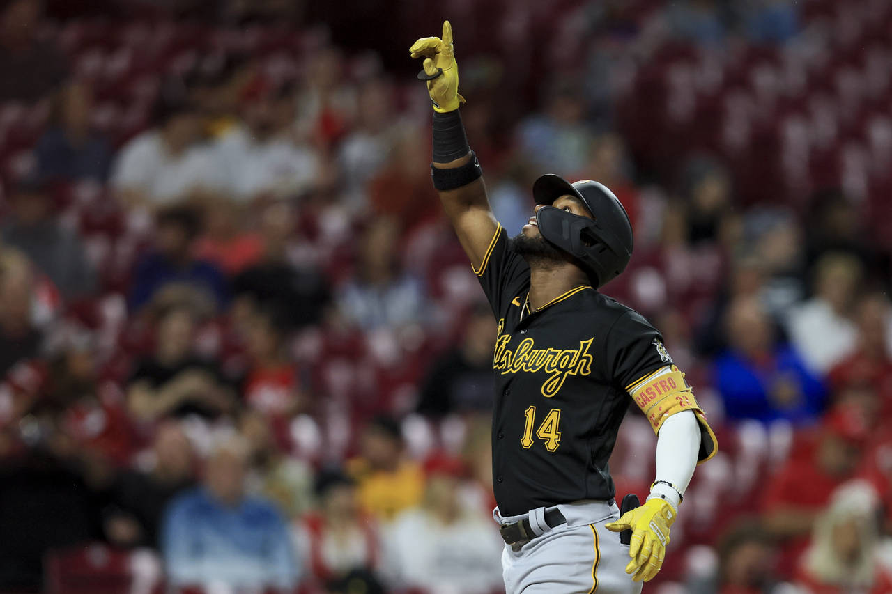 Pittsburgh Pirates' Rodolfo Castro points to the sky as he celebrates hitting a three-run home run ...