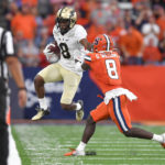 
              Purdue wide receiver TJ Sheffield, left, jumps out of bounds after a catch against Syracuse defensive back Garrett Williams during the second half of an NCAA college football game in Syracuse, N.Y., Saturday, Sept. 17, 2022. (AP Photo/Adrian Kraus)
            