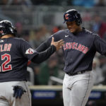
              Cleveland Guardians' Oscar Gonzalez, right, celebrates with Cleveland Guardians' Josh Naylor, left, after hitting a two-run home run during the fifth inning of a baseball game against the Minnesota Twins, Friday, Sept. 9, 2022, in Minneapolis. (AP Photo/Abbie Parr)
            