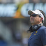 
              West Virginia head coach Neal Brown looks o during the first half of an NCAA college football game against Towson in Morgantown, W.Va., Saturday, Sept. 17, 2022. (AP Photo/William Wotring)
            