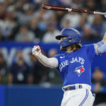 
              Toronto Blue Jays' Bo Bichette takes an at-bat in the fourth inning of baseball game action against the New York Yankees in Toronto, Monday, Sept. 26, 2022. (Cole Burston/The Canadian Press via AP)
            