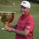 
              USA team captain Davis Love III holds the Presidents Cup trophy after team USA defeated the International team in match play at the Presidents Cup golf tournament at the Quail Hollow Club, Sunday, Sept. 25, 2022, in Charlotte, N.C. (AP Photo/Chris Carlson)
            