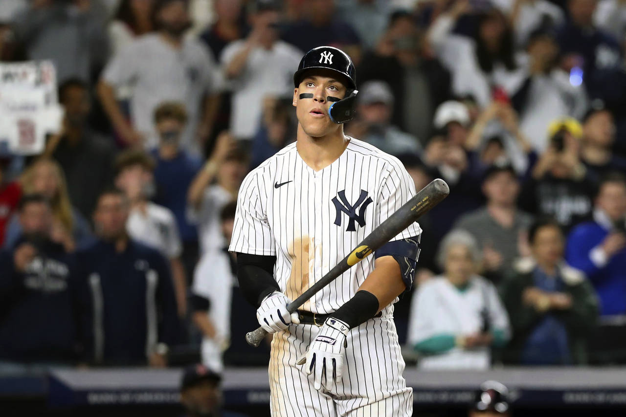 New York Yankees designated hitter Aaron Judge reacts after walking against Boston Red Sox starting...