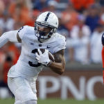 
              Penn State wide receiver Parker Washington (3) caries the ball against Auburn during the second half of an NCAA college football game, Saturday, Sept. 17, 2022, in Auburn, Ala. (AP Photo/Butch Dill)
            