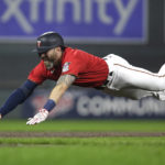 
              Minnesota Twins' Jake Cave dives into third base on a triple against the Los Angeles Angels during the fourth inning of a baseball game Saturday, Sept. 24, 2022, in Minneapolis. (AP Photo/Andy Clayton-King)
            