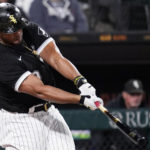 
              Chicago White Sox's Jose Abreu hits an RBI single during the third inning of the team's baseball game against the Detroit Tigers in Chicago, Friday, Sept. 23, 2022. (AP Photo/Nam Y. Huh)
            