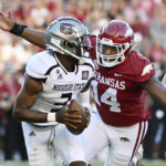 
              Arkansas defensive lineman Jordan Domineck (14) prepares to sack Missouri State quarterback Jason Shelly (3) during the first half of an NCAA college football game Saturday, Sept. 17, 2022, in Fayetteville, Ark. (AP Photo/Michael Woods)
            