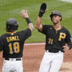 
              Pittsburgh Pirates' Cal Mitchell (31) and Ben Gamel (18) celebrate after scoring on a double by Josh VanMeter during the fourth inning of a baseball game against the Toronto Blue Jays, Sunday, Sept. 4, 2022, in Pittsburgh. (AP Photo/Keith Srakocic)
            