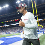 
              Tampa Bay Buccaneers quarterback Tom Brady (12) returns to the field in the second half of an NFL preseason football game against the Indianapolis Colts in Indianapolis, Saturday, Aug. 27, 2022. (AP Photo/AJ Mast)
            