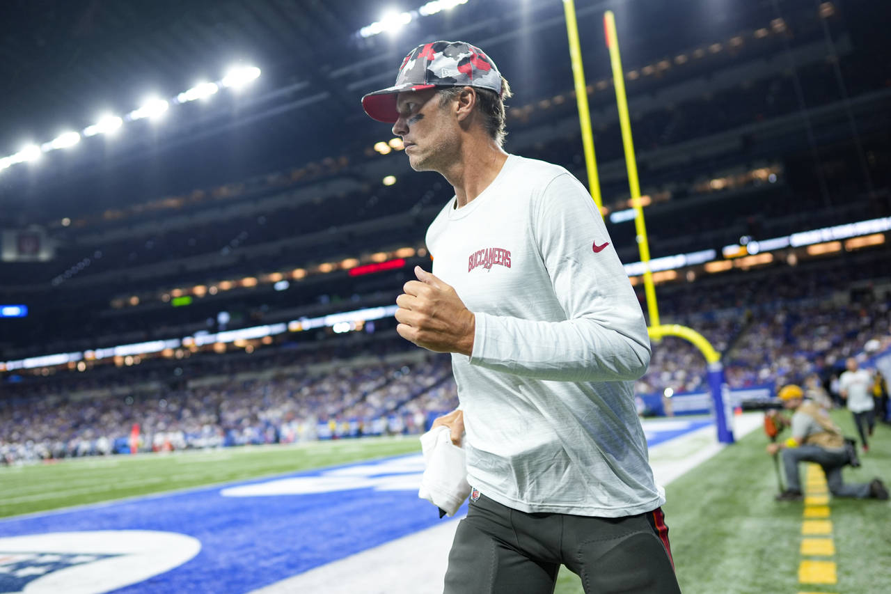 Tampa Bay Buccaneers quarterback Tom Brady (12) returns to the field in the second half of an NFL p...