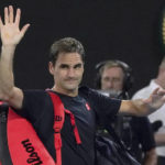 
              FILE - Switzerland's Roger Federer waves as he leaves Rod Laver Arena following his loss to Serbia's Novak Djokovic in their semifinal match at the Australian Open tennis championship in Melbourne, Australia, Jan. 30, 2020. Federer announced Thursday, Sept. 15, 2022 he is retiring from tennis. (AP Photo/Lee Jin-man)
            