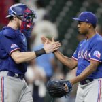 
              Texas Rangers relief pitcher Jose Leclerc, right, and catcher Sam Huff clasp hands after the team's victory over the Houston Astros in a baseball game, Tuesday, Sept. 6, 2022, in Houston. (AP Photo/Eric Christian Smith)
            
