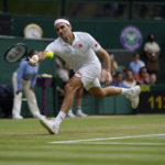 
              FILE - Switzerland's Roger Federer plays a return to Britain's Cameron Norrie during the men's singles third round match on day six of the Wimbledon Tennis Championships in London, Saturday July 3, 2021. Federer announced Thursday, Sept.15, 2022 he is retiring from tennis. (AP Photo/Alastair Grant, File)
            