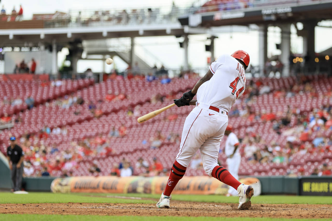Cincinnati Reds' Aristides Aquino hits a grand slam during the sixth inning of the second game of a...