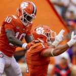 
              Clemson Tigers wide receiver Joseph Ngata (10) celebrates with running back Will Shipley (1) after a touchdown by Shipley in the first quarter during an NCAA college football game against the Furman Paladins in Clemson, S.C., Saturday, Sept. 10, 2022. (AP Photo/Jacob Kupferman)
            