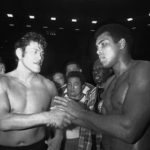 
              CORRECTS TO 1976, NOT 1979 - FILE - Wrestler Antonio Inoki, left, and world heavyweight boxing champion Muhammad Ali shake hands after a 15-round boxing- wrestling fight on June 26, 1976, at Tokyo's Budokan hall. A popular Japanese professional wrestler and lawmaker Antonio Inoki, who faced a world boxing champion Muhammad Ali in a mixed martial arts match in 1976, has died at 79. The New Japan Pro-Wrestling Co. says Inoki, who was battling an illness, died earlier Saturday, Oct. 1, 2022. (AP Photo, File)
            