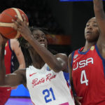 
              Puerto Rico's Mya Hollingshed tries to shoot past United States' Jewell Loyd at the women's Basketball World Cup in Sydney, Australia, Friday, Sept. 23, 2022. (AP Photo/Mark Baker)
            