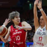 
              Japan's Ramu Tokashiki, left, lays up for a shot at goal as Serbia's Jovana Nogic attempts to block during their game at the women's Basketball World Cup in Sydney, Australia, Friday, Sept. 23, 2022. (AP Photo/Mark Baker)
            