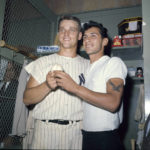 
              FILE - New York Yankees slugger Roger Maris poses with fan Sal Durante in the locker room at Yankee Stadium, Oct. 1, 1961, after hitting his 61st home run of the season. Durante caught Maris' fourth inning home run into the right field seats as Maris broke Babe Ruth's single-season home run record. If Aaron Judge passes Roger Maris, some lucky fan might become this generation's Sal Durante. (AP Photo/File)
            