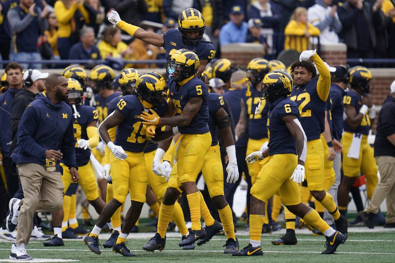Michigan defensive back DJ Turner (5) celebrates his interception against Maryland in the first hal...