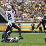 
              New England Patriots cornerback Jalen Mills (2) intercepts a pass intended for Pittsburgh Steelers wide receiver Diontae Johnson (18) iduring the first half of an NFL football game in Pittsburgh, Sunday, Sept. 18, 2022. (AP Photo/Don Wright)
            