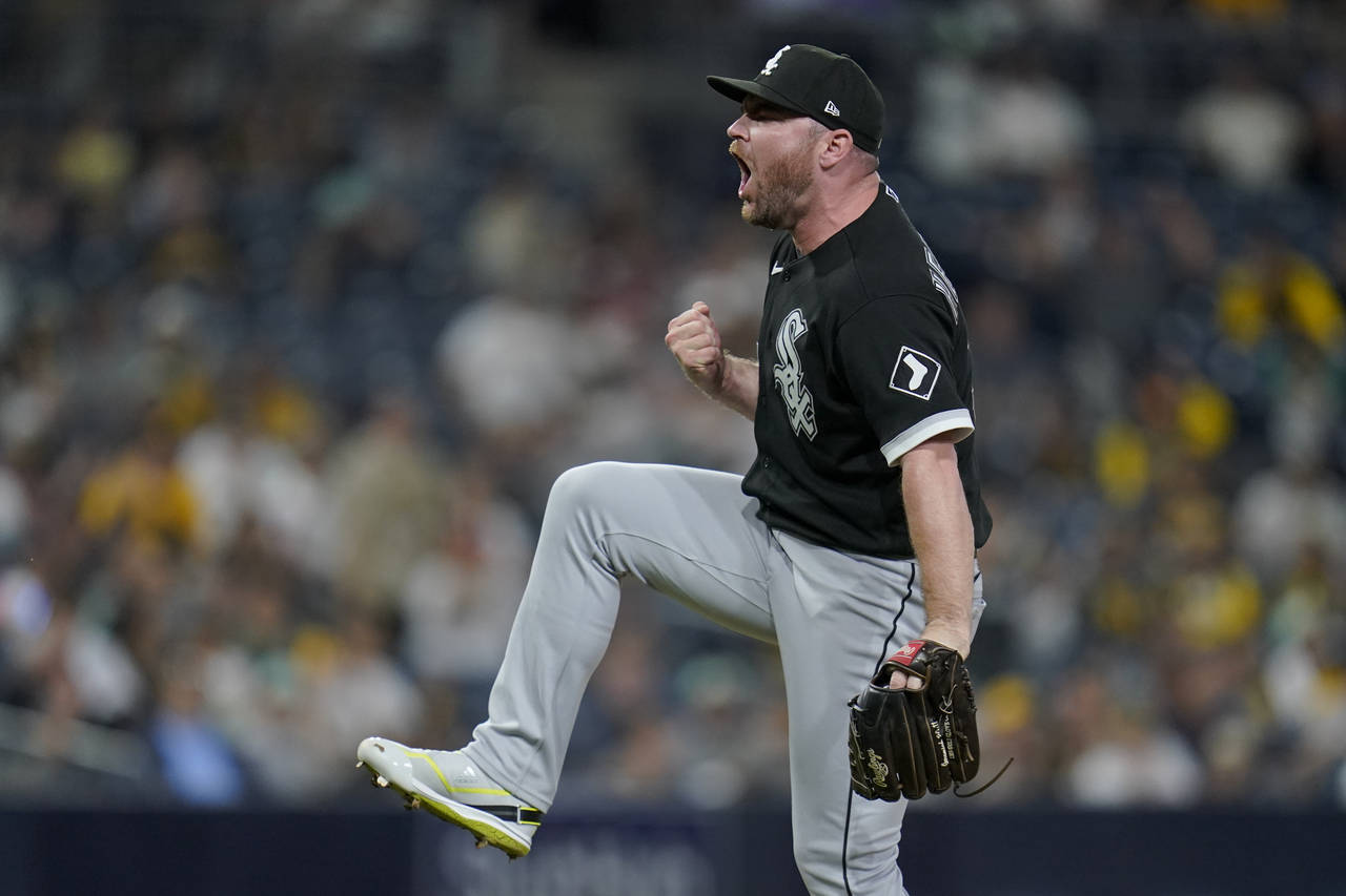 Chicago White Sox relief pitcher Liam Hendriks celebrates after the White Sox defeated the San Dieg...