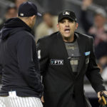 
              Home plate umpire Brian Knight talks with New York Yankees manager Aaron Boone after throwing Boone out of the Yankees' baseball game against the Boston Red Sox during the sixth inning Friday, Sept. 23, 2022, in New York. (AP Photo/Adam Hunger)
            
