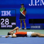 
              Carlos Alcaraz, of Spain, lies on the court after beating Jannik Sinner, of Italy, during the quarterfinals of the U.S. Open tennis championships, early Thursday, Sept. 8, 2022, in New York. (AP Photo/Frank Franklin II)
            
