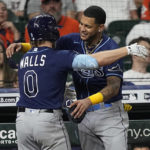 
              Tampa Bay Rays' Taylor Walls (0) celebrates with Jose Siri after hitting a home urn against the Houston Astros during the eighth inning of a baseball game Friday, Sept. 30, 2022, in Houston. (AP Photo/David J. Phillip)
            