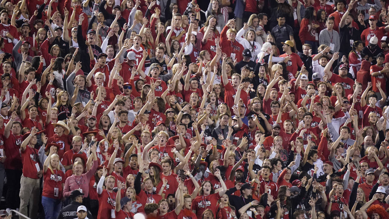 The Utah student section show their support during the first half of an NCAA college football game ...