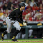
              Pittsburgh Pirates' Bryan Reynolds watches his broken bat single during the fifth inning of a baseball game against the Cincinnati Reds in Cincinnati, Monday, Sept. 12, 2022. (AP Photo/Aaron Doster)
            
