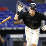 
              Miami Marlins' Brian Anderson tosses his bat after flying out during the fifth inning of a baseball game against the Texas Rangers, Monday, Sept. 12, 2022, in Miami. (AP Photo/Lynne Sladky)
            