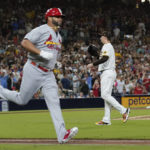 
              San Diego Padres starting pitcher Blake Snell, right, looks to the catcher after giving up his first hit of the night, a single to St. Louis Cardinals' Albert Pujols, left, during the seventh inning of a baseball game Wednesday, Sept. 21, 2022, in San Diego. (AP Photo/Gregory Bull)
            