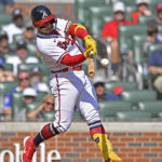 
              Atlanta Braves' William Contreras hits a home run in the sixth inning of a baseball game against the Philadelphia Phillies, Sunday, Sept. 18, 2022, in Atlanta. (AP Photo/Edward M. Pio Roda)
            