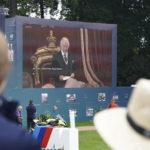 
              Spectators watch the Accession Council, where King Charles III is formally proclaimed monarch, on the big screen at Wentworth Golf Club, Virginia Water, Britain, Saturday, Sept. 10, 2022. (Adam Davy/PA via AP)
            