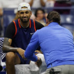 
              Nick Kyrgios, of Australia, is attended by a trainer as he plays Karen Khachanov, of Russia, during the quarterfinals of the U.S. Open tennis championships, Tuesday, Sept. 6, 2022, in New York. (AP Photo/Charles Krupa)
            