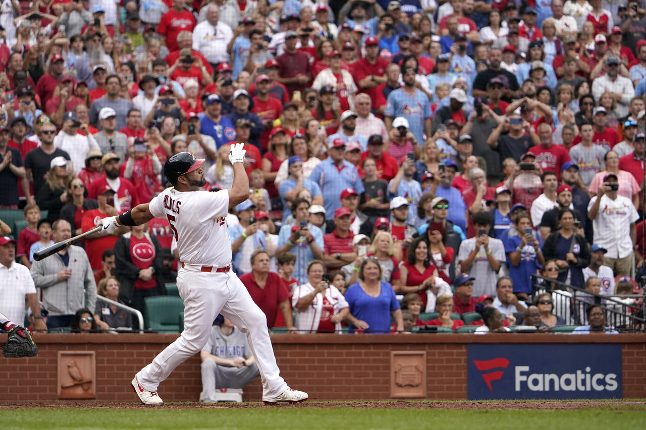 St. Louis Cardinals' Albert Pujols watches his two-run home run during the eighth inning of a baseb...