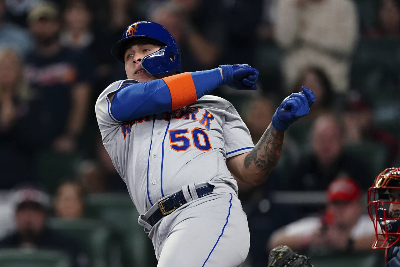 New York Mets' Francisco Álvarez loses his bat as he strikes out during the ninth inning of the te...