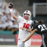 
              Hawaii defensive back Matagi Thompson (25) closes in on Western Kentucky quarterback Austin Reed (16) during the first half of an NCAA college football game Saturday, Sept. 3, 2022, in Honolulu. (AP Photo/Marco Garcia)
            