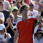 
              Andrey Rublev, of Russia, waves to the crowd after defeating Soonwoo Kwon, of South Korea, during the second round of the U.S. Open tennis championships, Thursday, Sept. 1, 2022, in New York. (AP Photo/John Minchillo)
            