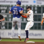 
              Houston Astros second baseman Jose Altuve (27) tags out Texas Rangers' Nathaniel Lowe (30) on a force to end the top of the fifth inning of a baseball game Tuesday, Sept. 6, 2022, in Houston. (AP Photo/Eric Christian Smith)
            